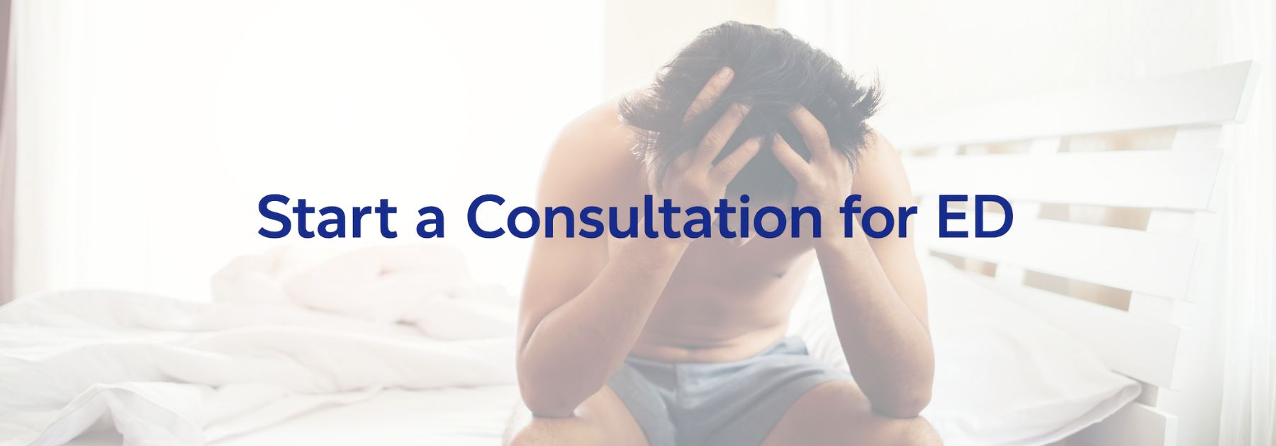 man sat on the edge of a bed